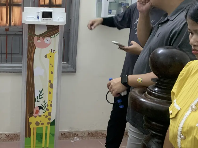 The prototype board set up in standing mode inside a Vietnamese health station.